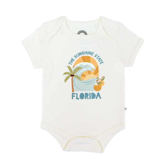 Florida Sunshine State baby onesie – soft & stretchy 100% cotton with unique vintage-inspired print, snap bottom, and fold-over shoulders for easy dressing.