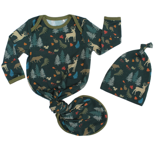 baby gown with forest print on white background.