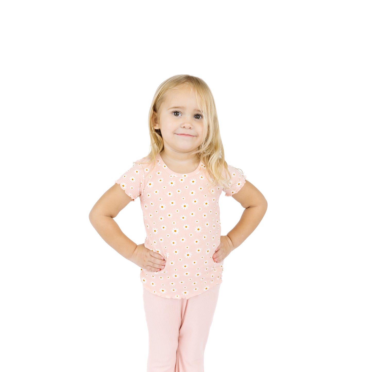 Young girl wearing a pink outfit with a white background