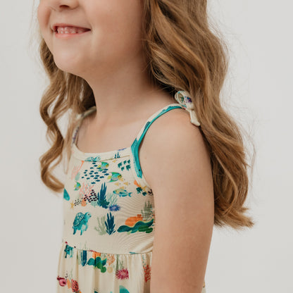 Sundress close up of our Emerson and Friends Coral Reef Bamboo Sundress featuring an ocean-inspired print with sharks, sea turtles, and coral, made from ultra-soft and breathable bamboo fabric for a lightweight and comfortable summer outfit.