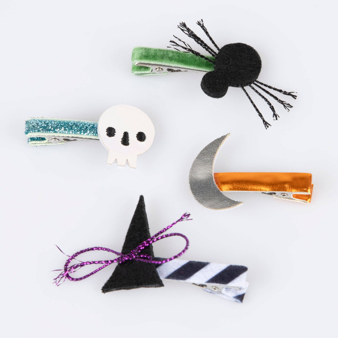 Set of Halloween-themed hair clips on a white background