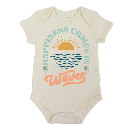 Beige baby bodysuit with 'Happiness Comes in Waves' text and graphics on a white background