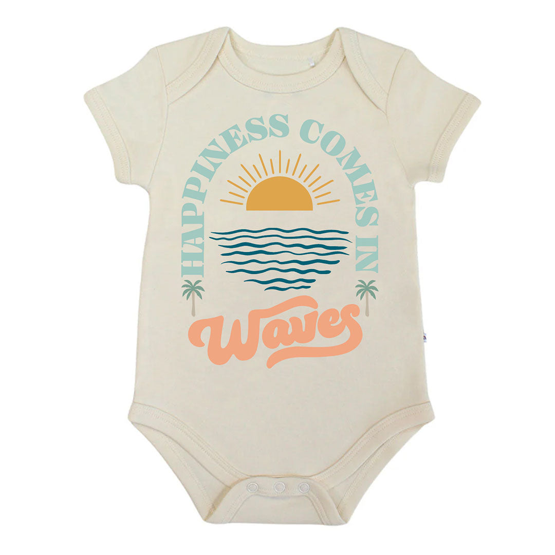 Beige baby onesie with 'Happiness Comes in Waves' text and graphics on a white background