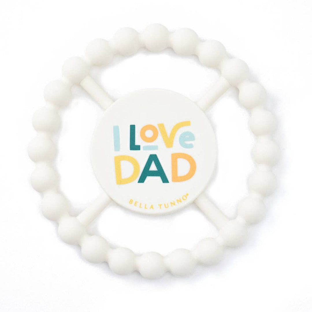 round white silicone teething toy that says I love dad in multi colors