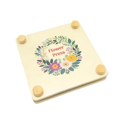 Wooden flower press with floral design and 'Flower Press' text on a white background