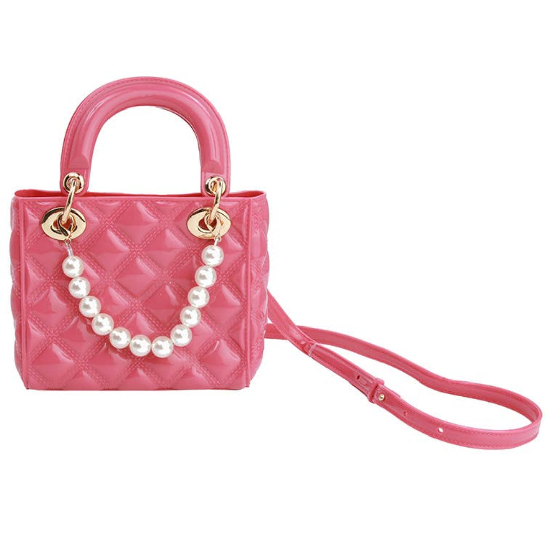 Pink jelly bag with a pearl strap on the front