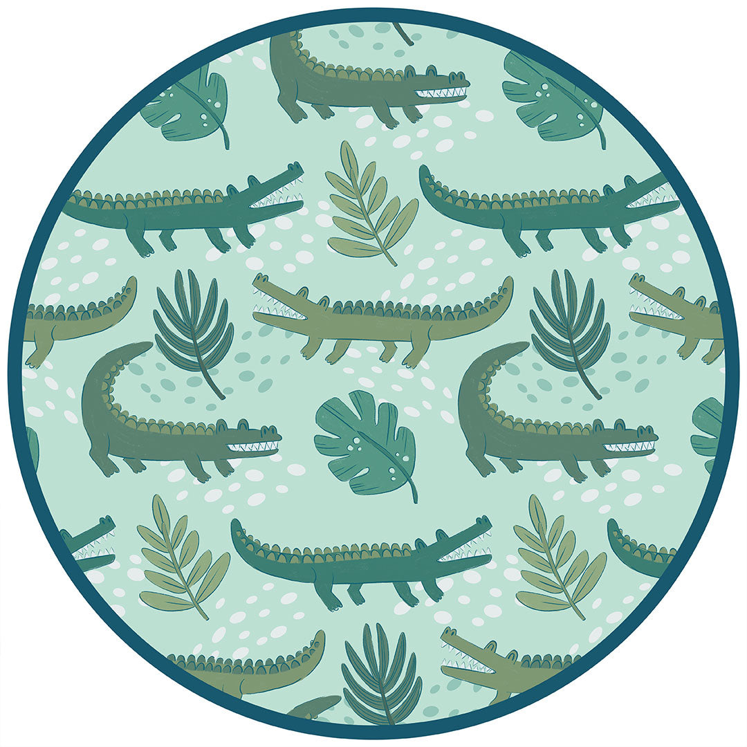 the "later gator" print has a mix of light and dark green alligators, leaves, and white dots scattered on a teal colored background. 