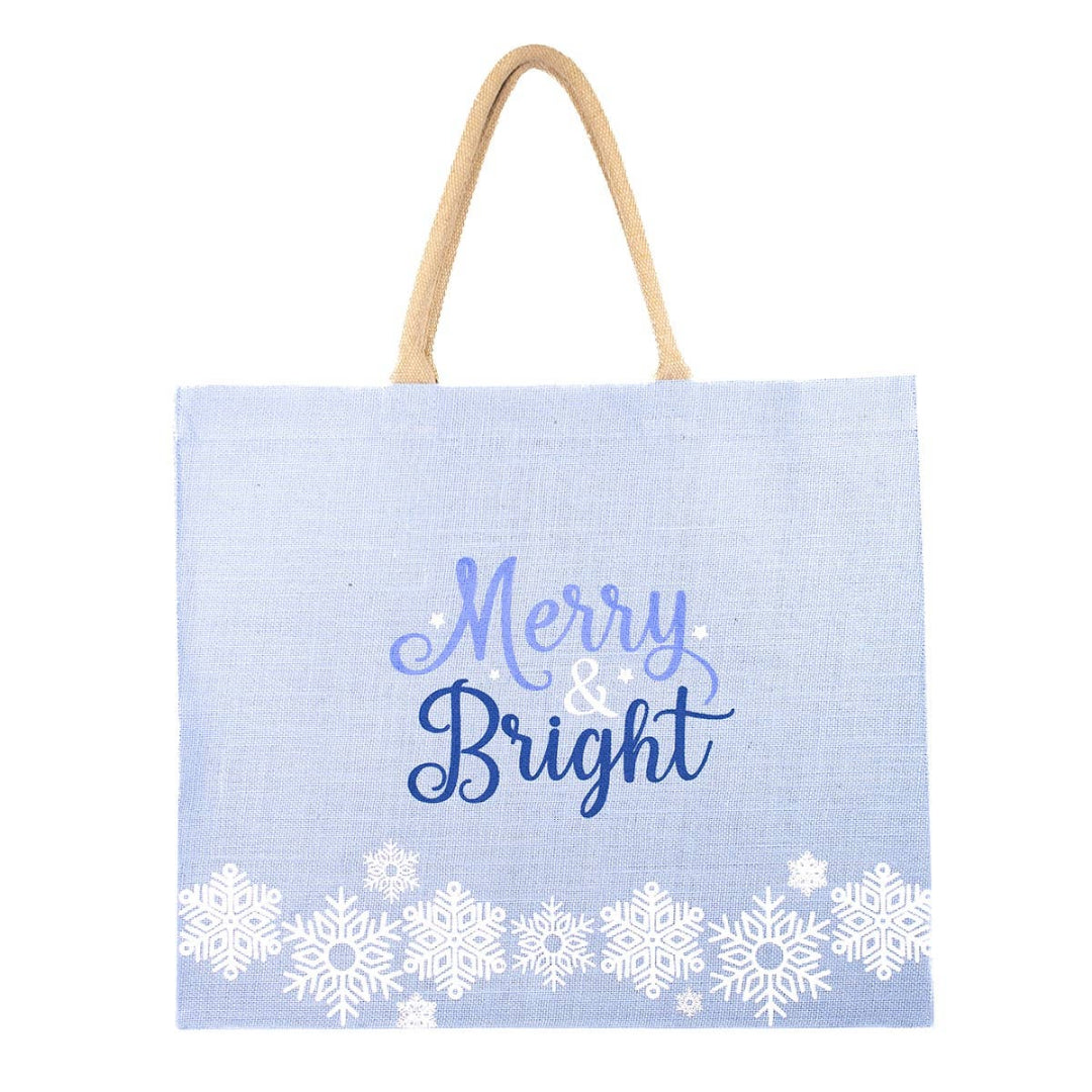 large tote bag thats light blue with white snowflakes along the bottom and it says Merry and Bright