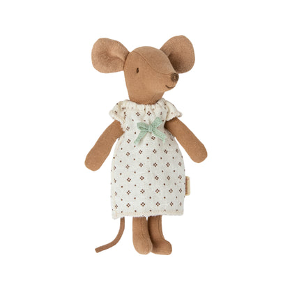 Stuffed mouse toy wearing a white dress with a green bow on a white background