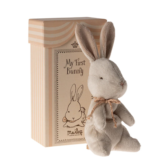 Stuffed bunny toy with 'My First Bunny' packaging on a white background
