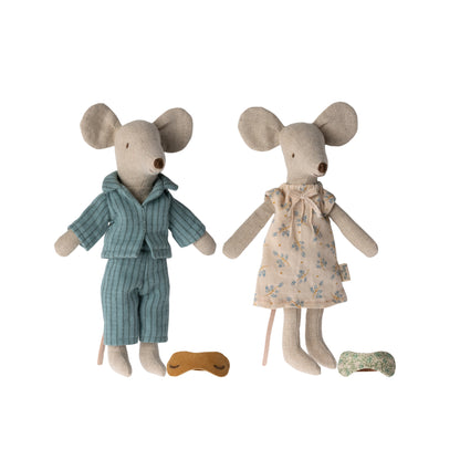 Two toy mice, one in pajamas and the other in a dress, on a white background.