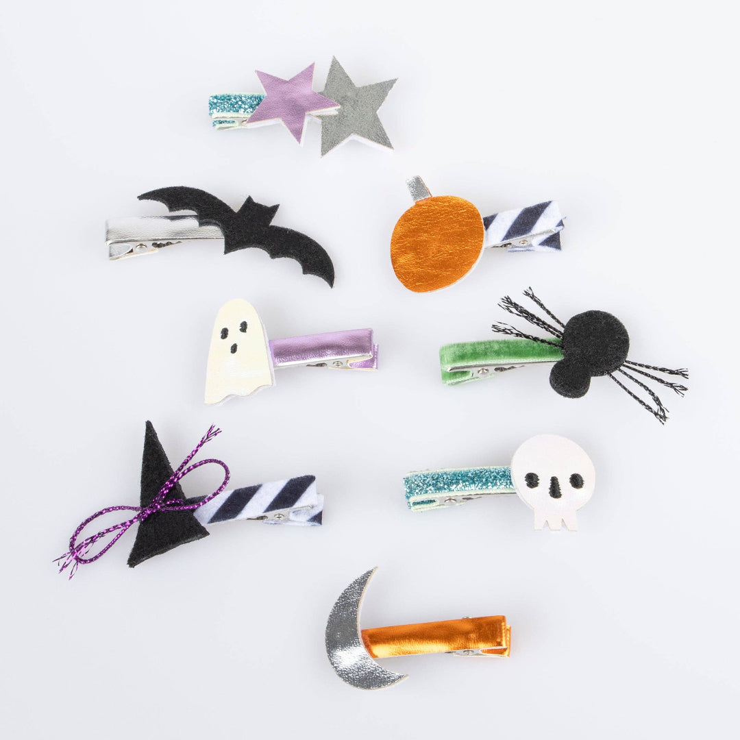 Halloween-themed hair clips on a white background
