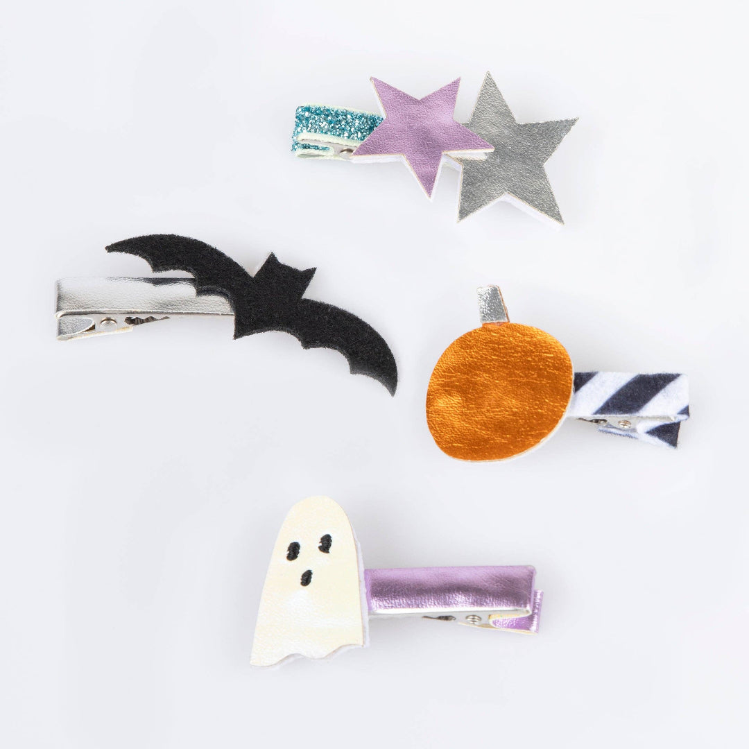 Set of Halloween-themed hair clips on a white background