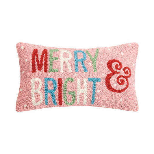 Pink pillow saying Merry and Bright