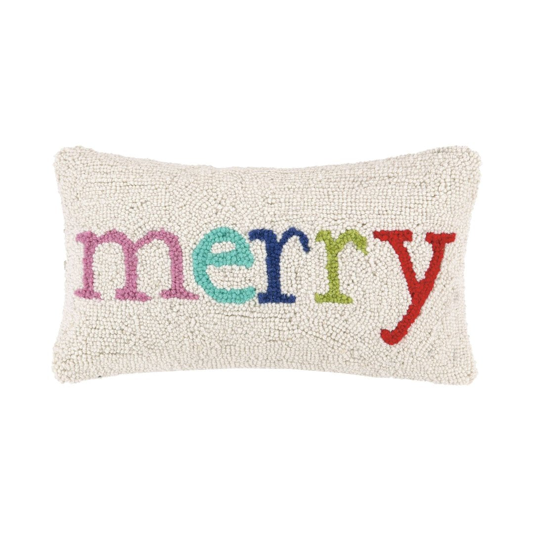 pillow with the word merry multicolored