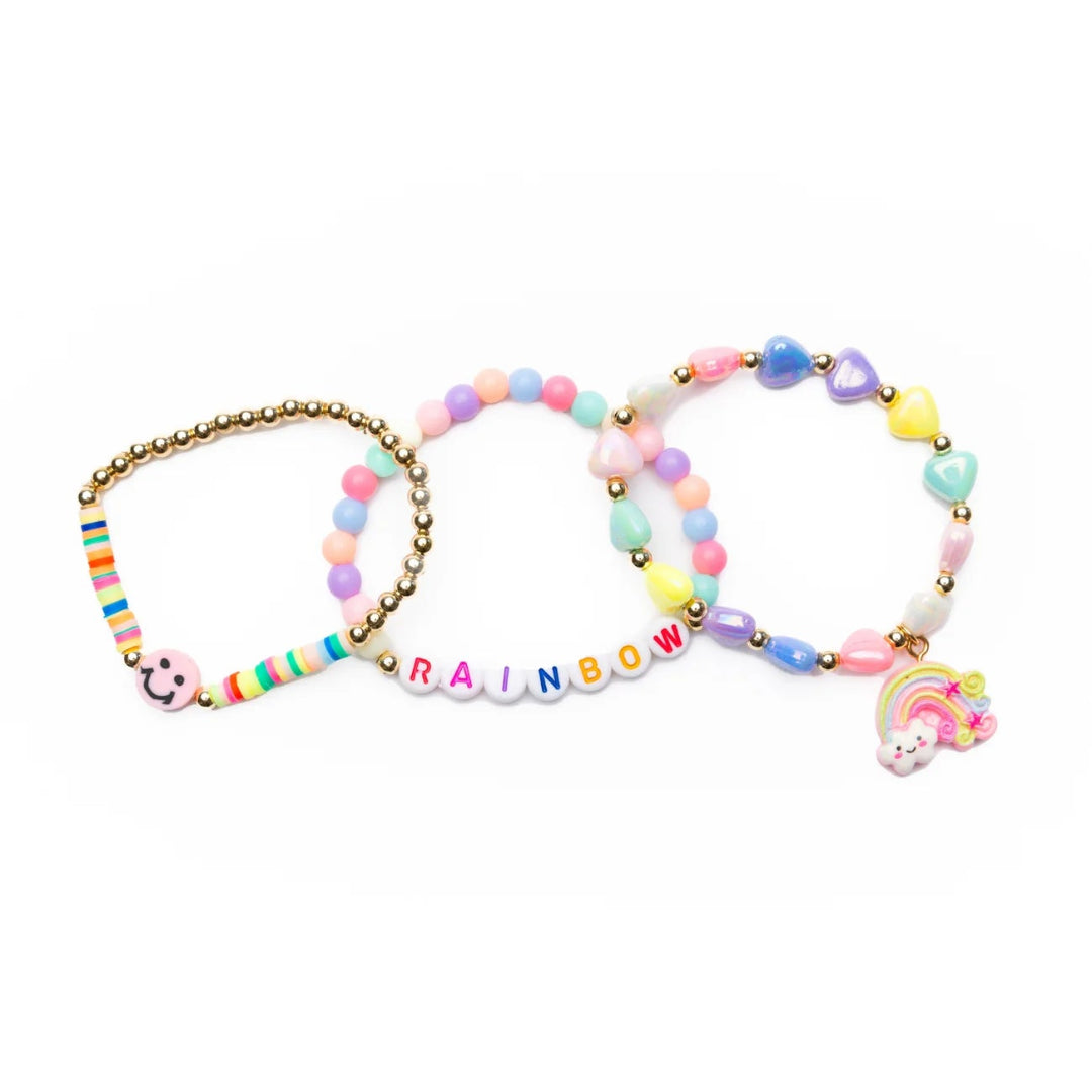 Set of three pastel colorful beaded bracelets with smiley face charm, rainbow charm and letter beads spelling "rainbow" from Great Pretenders