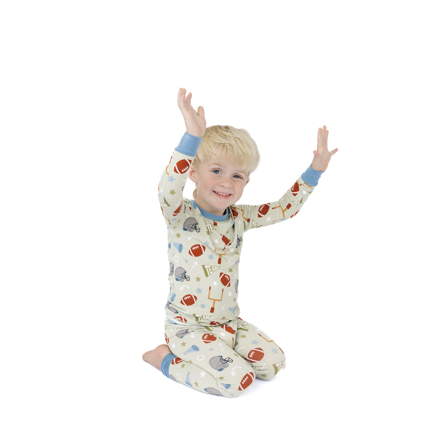 Child wearing a patterned pajama set on a white background