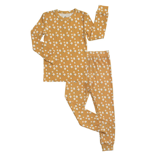 mustard pajama set with white flowers on a white background.