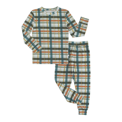 pajama set with plaid print on white background. 