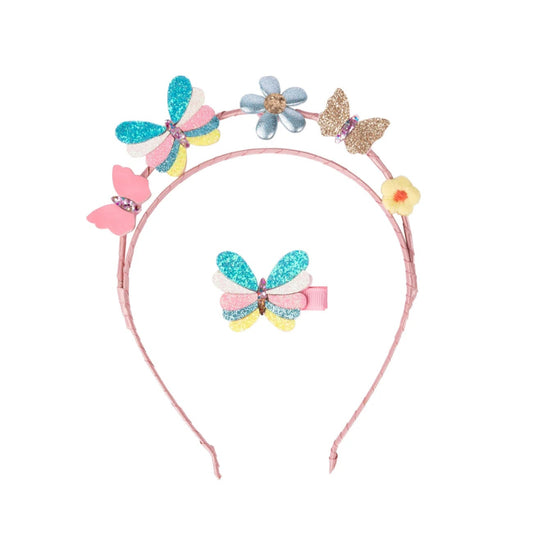 Pink headband with pink, gold, pastel colored butterflies and flowers on it and a matching butterfly hair clip from Great Pretenders 