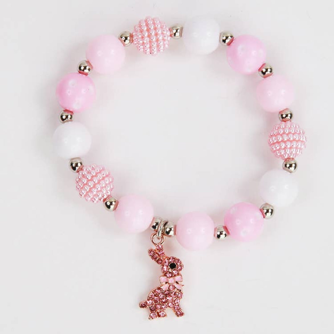 pink and white pearl bracelet with a pink bunny charm