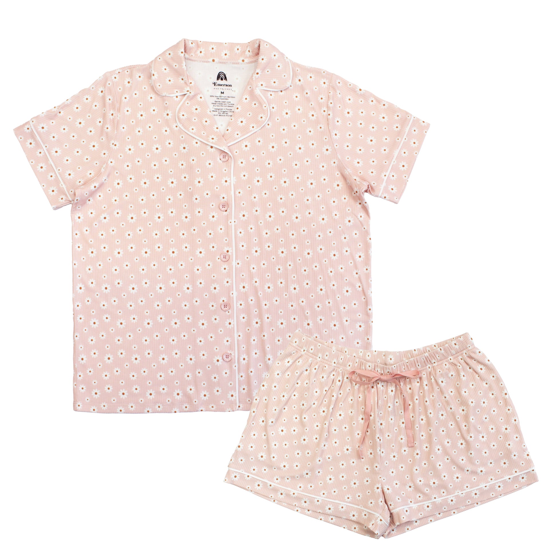 Pink pajama set with white floral pattern on a white background