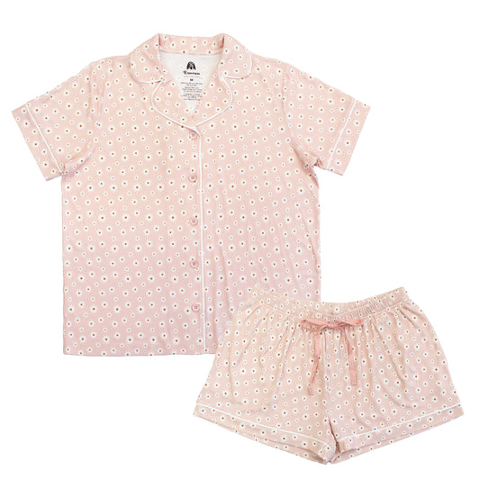 Pink pajama set with white floral pattern on a white background