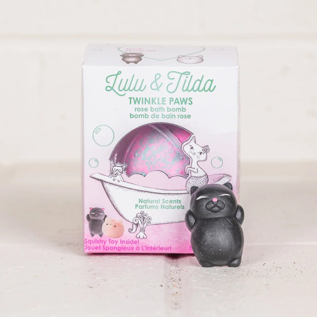 Pink bath bomb inside the box with a black cat, one of the two surprise toys inside the bath bomb from Great Pretenders