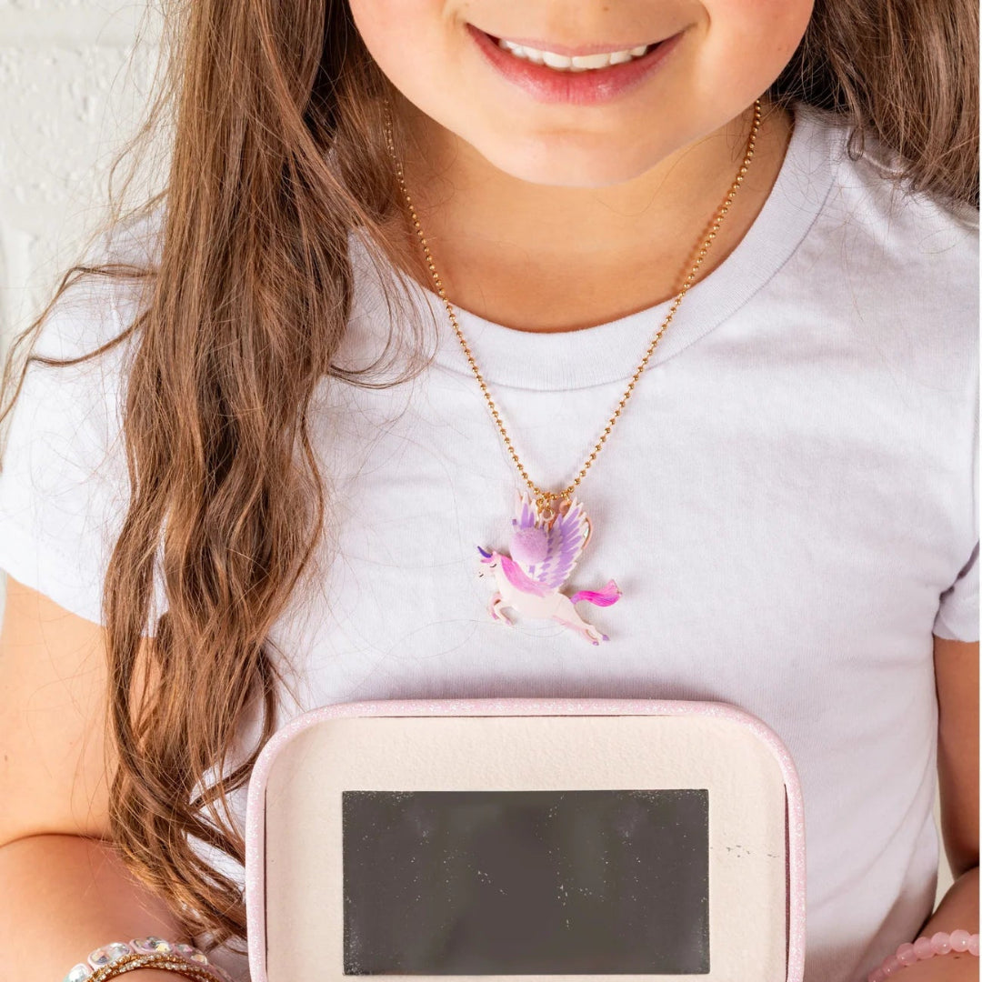 Child wearing a unicorn charm necklace from Great Pretenders