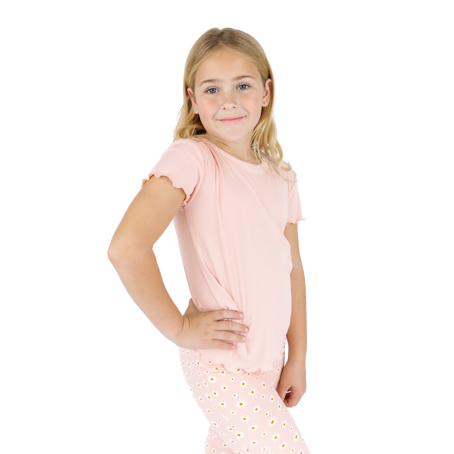 Young girl wearing a pink outfit on a white background