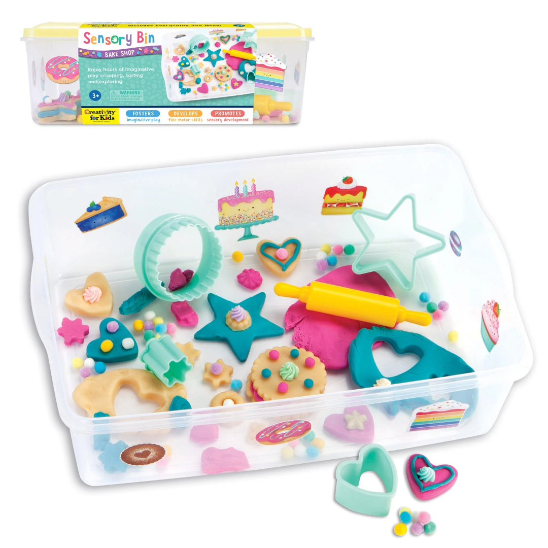 Children's play dough set with tools and containers on a white background