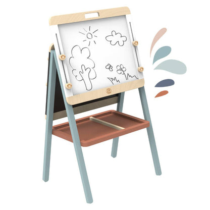 a wooden adjustable art easel that has a white board with a drawing in black marker of a tree, sunshine, cloud, and flowers with a butterfly