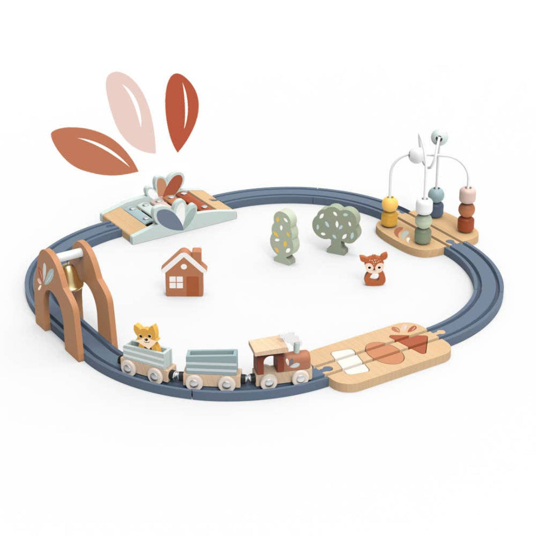 A wooden blue railroad toy with multicolored trains and wooden accessories including animals, trees, and a house