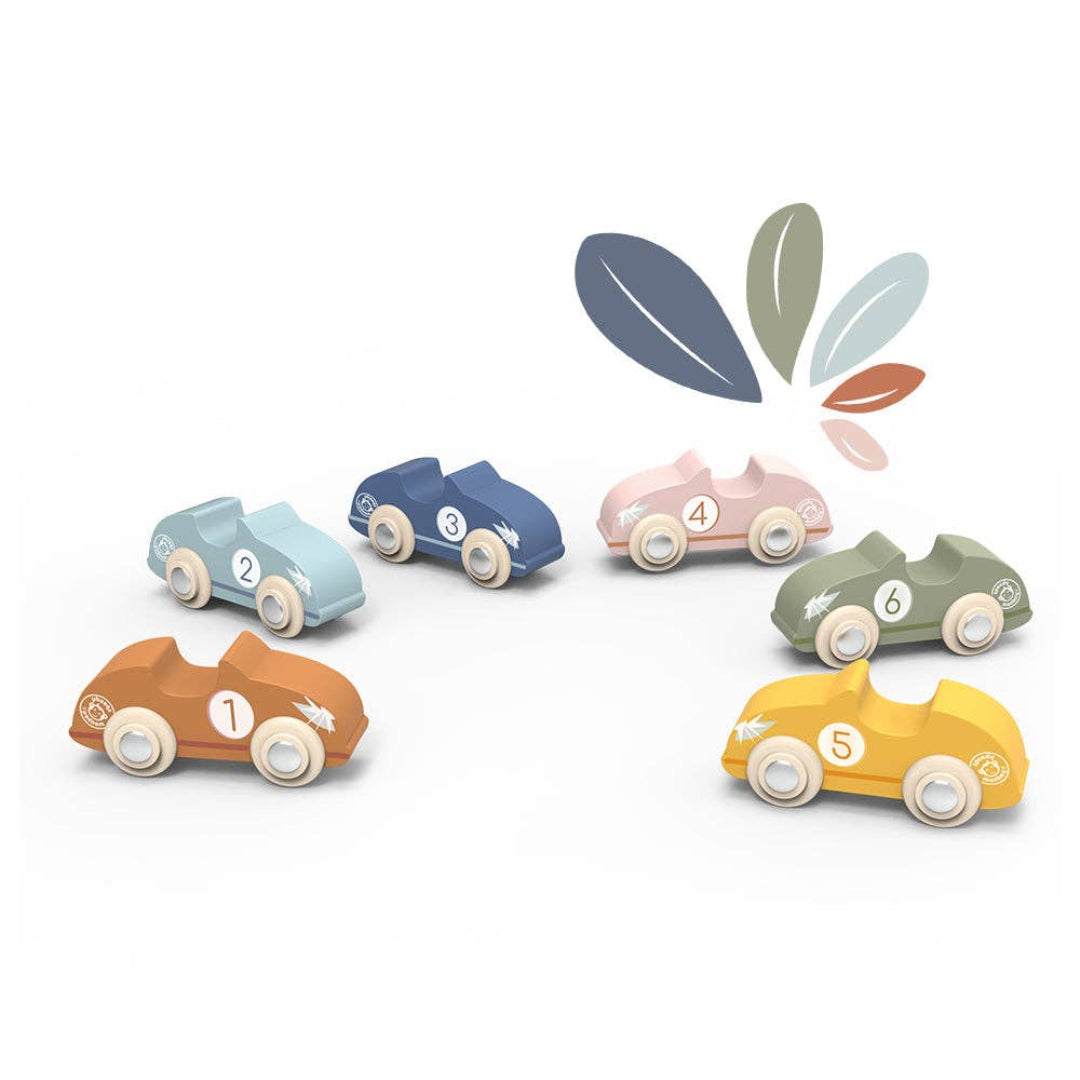 6 wooden race cars in a very simple design, that are all different colors including brown, light blue, dark blue, pink, green, and yellow