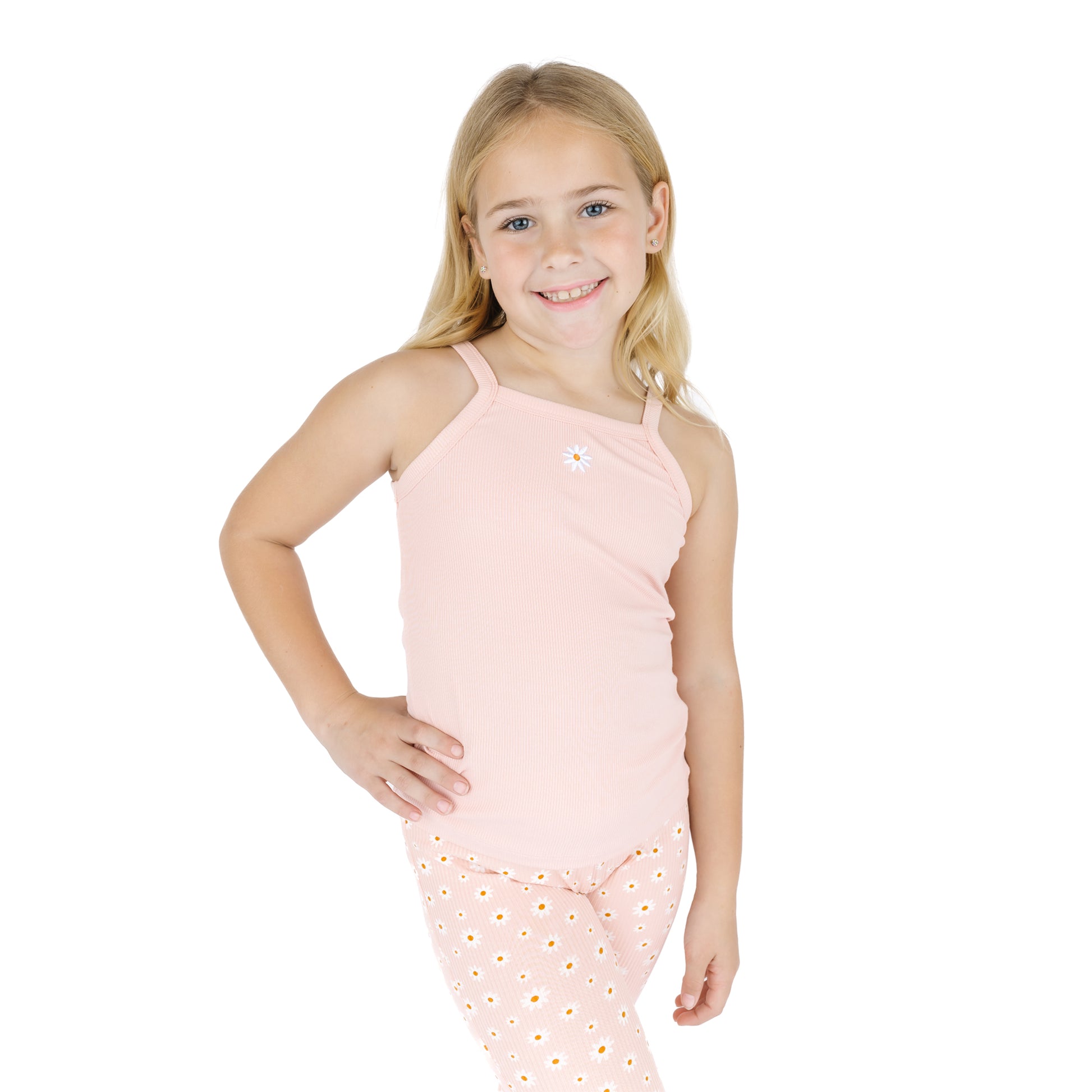 Young girl wearing a pink sleeveless top and pants with a white background