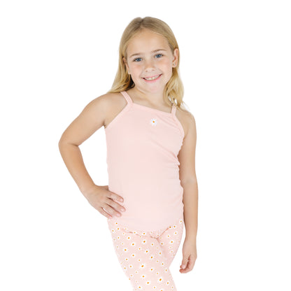 Young girl wearing a pink sleeveless top and pants with a white background