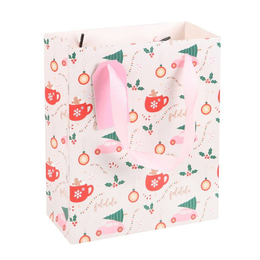 cream colored gift bag with christmas print on the front