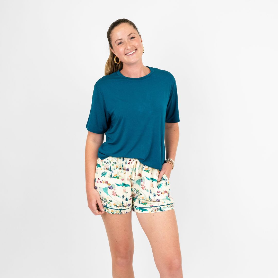 Soft and breathable women’s pajama shorts made from eco-friendly bamboo fabric, featuring a vibrant coral reef print in soothing ocean hues. Designed for ultimate comfort and a relaxed fit, perfect for lounging or sleeping."