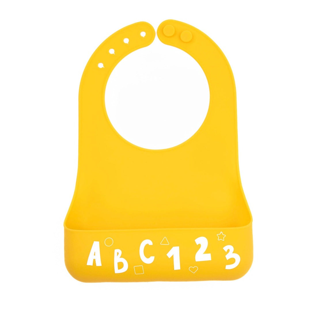 bright yellow silicone baby bib with white letters and numbers along the bottom