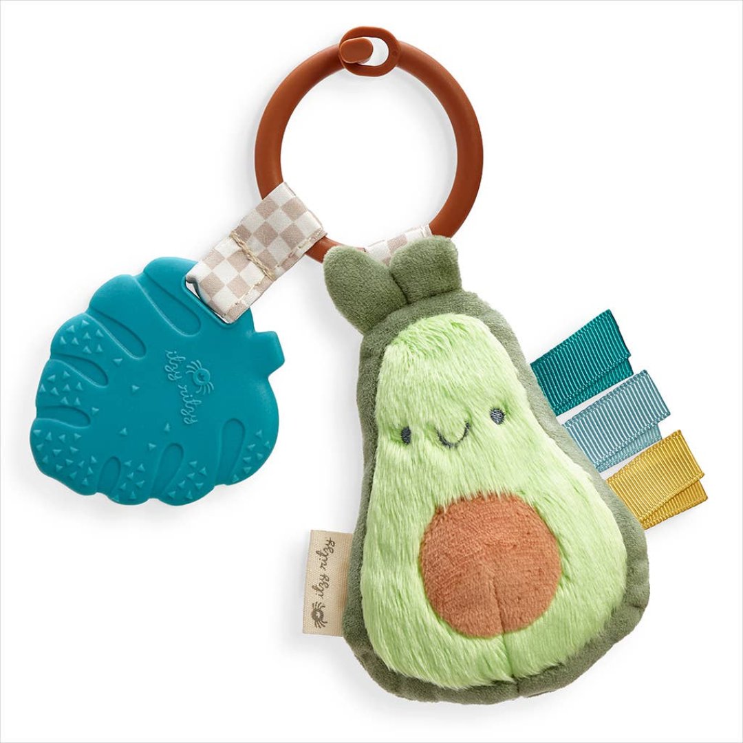 stuffed avocado toy with a teether attached