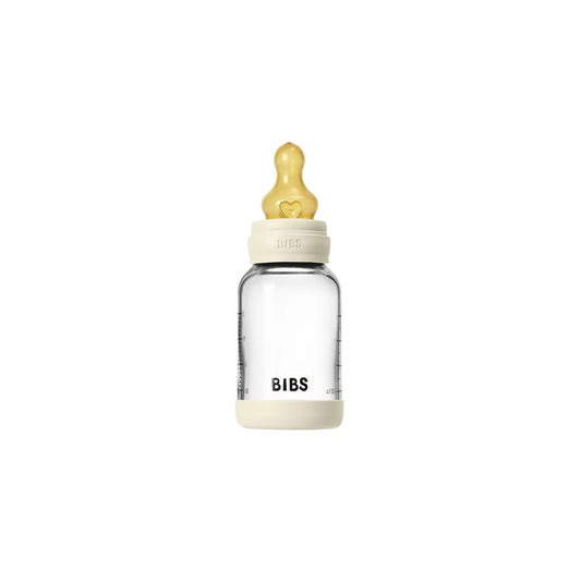 Clear baby bottle with a yellow nipple on a white background, branded 'BIBS'.