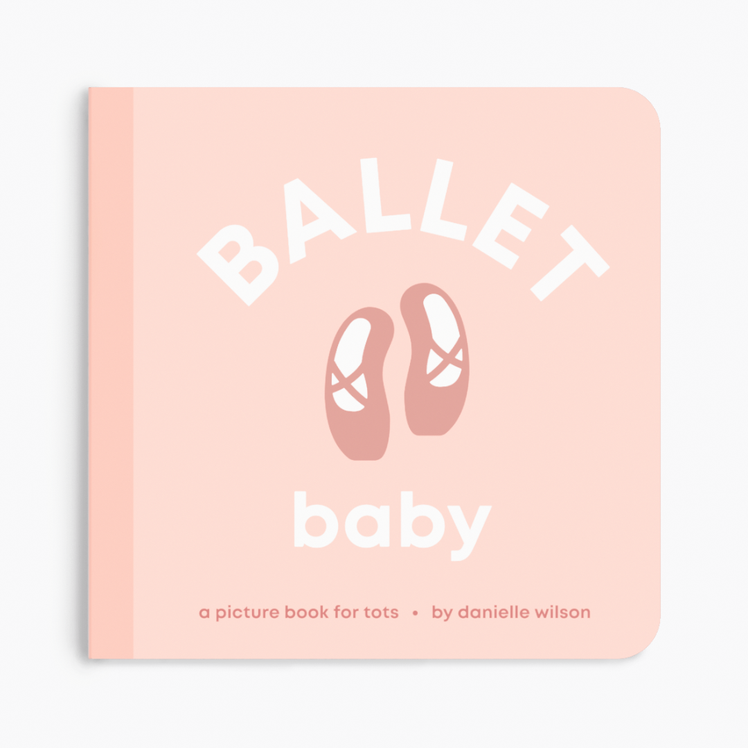 a pink book with ballet shoes in the center of the book cover