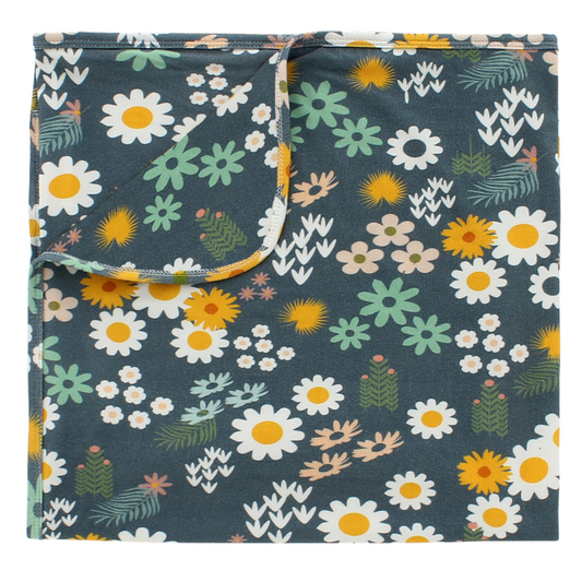 the "blue daisy" bamboo blanket. the "blue daisy" print is an arrangement of tons of different, colorful flowers scattered around a dark blue print. 