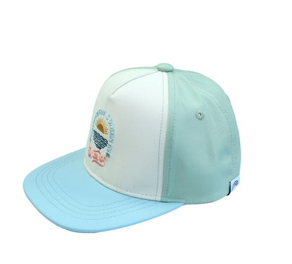 A stylish kids' and baby snapback hat in pastel blue and green, featuring embroidered text "Happiness Comes in Waves" with a sun and ocean design. Perfect for coastal adventures.