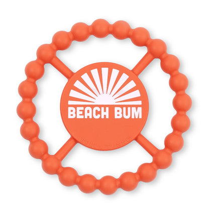 round orange baby teether with the words beach bum written in white letters on the front