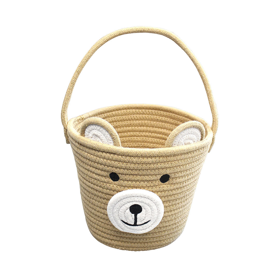 a woven beige basket with a white bear face on it. 