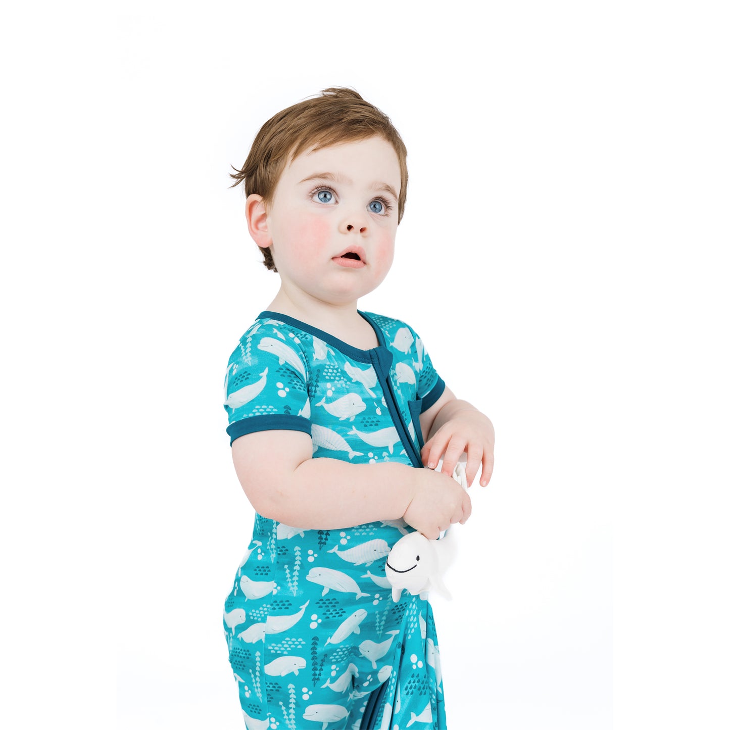 Baby holding our Beluga Lovey 