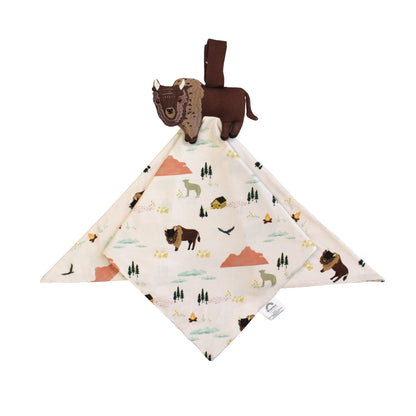 Baby comfort blanket with nature-themed design and attached plush bison toy on a white background