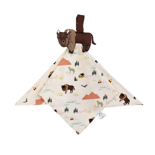 Baby comfort blanket with nature-themed design and attached plush bison toy on a white background