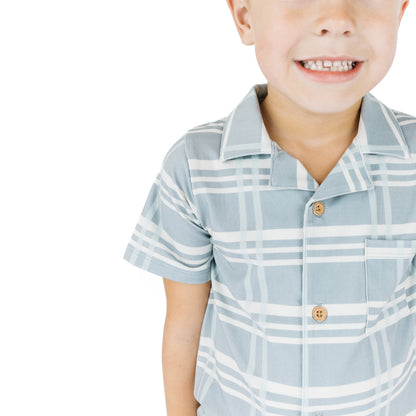 Boy wearing our Bamboo Blue plaid Button down shirt.